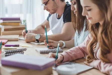 young-multicultural-students-writing-copybooks-young-multicultural-students-writing-129335300-transformed writing